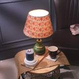 Green Sphere Shaped Lamp With Beige Floral Shade